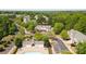 Scenic aerial view of townhome community nestled amongst lush green trees and landscaping on a sunny day at 1032 Eagles Nest Ln, Indian Land, SC 29707