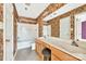 Bathroom featuring a dual sink vanity, neutral flooring, and shower over tub at 1032 Eagles Nest Ln, Indian Land, SC 29707