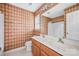 Bathroom with double vanity, tub and shower combination, and patterned wallpaper at 1032 Eagles Nest Ln, Indian Land, SC 29707