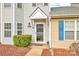 Welcoming front entrance with a well-kept lawn and charming details at 1032 Eagles Nest Ln, Indian Land, SC 29707