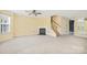 Spacious living room with fireplace and stairs at 1032 Eagles Nest Ln, Indian Land, SC 29707