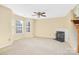 Bright and airy living room featuring a cozy fireplace and staircase at 1032 Eagles Nest Ln, Indian Land, SC 29707