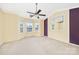 Large main bedroom features a ceiling fan, mirror, and bay window with natural light at 1032 Eagles Nest Ln, Indian Land, SC 29707