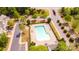Aerial view of a community pool, surrounded by lounge chairs and meticulously maintained landscaping at 1032 Eagles Nest Ln, Indian Land, SC 29707