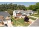 Aerial shot of a beautiful home with a well-manicured lawn and mature trees at 11312 Fox Hill Dr, Charlotte, NC 28269