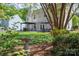 Landscaped backyard with patio and dining set, providing an inviting outdoor living space at 11312 Fox Hill Dr, Charlotte, NC 28269