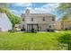 Spacious backyard featuring a patio area, ideal for outdoor gatherings and recreation at 11312 Fox Hill Dr, Charlotte, NC 28269