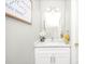 Bathroom with white vanity, marble counter, decorative mirror, and modern fixtures at 11312 Fox Hill Dr, Charlotte, NC 28269