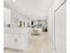 Open concept featuring white cabinetry, a dining area, and a glimpse into a living space at 11312 Fox Hill Dr, Charlotte, NC 28269