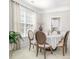 Elegant dining room featuring a large window, classic decor, and a round table at 11312 Fox Hill Dr, Charlotte, NC 28269