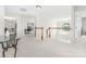 Bright hallway with white walls, neutral carpet, and views into adjacent rooms at 11312 Fox Hill Dr, Charlotte, NC 28269