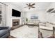 Inviting living room with fireplace, TV, neutral furniture, and ample lighting at 11312 Fox Hill Dr, Charlotte, NC 28269