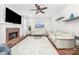 Comfortable living room with brick fireplace, TV, and plush sofas at 11312 Fox Hill Dr, Charlotte, NC 28269