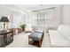 Cozy living room with ample natural light, comfortable seating, and neutral decor at 11312 Fox Hill Dr, Charlotte, NC 28269