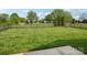 Expansive backyard features lush green grass and a black metal fence, perfect for outdoor activities at 117 Pine Lake Dr, Monroe, NC 28110
