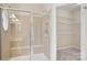 Tiled walk-in shower with glass door and access to walk in closet at 117 Pine Lake Dr, Monroe, NC 28110