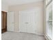 A spacious bedroom features ample closet space, and is filled with natural light at 117 Pine Lake Dr, Monroe, NC 28110
