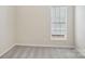 A bright bedroom features a window, neutral walls, and plush carpet at 117 Pine Lake Dr, Monroe, NC 28110