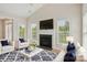 Comfortable living room featuring a cozy fireplace and stylish furnishings, perfect for relaxing and entertaining guests at 117 Pine Lake Dr, Monroe, NC 28110