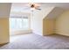 Large carpeted bedroom with a ceiling fan, dormer window seat, and plenty of natural light at 1215 39Th Ne Ave, Hickory, NC 28601
