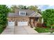 Charming two-story home with stone facade, two-car garage, covered porch and well-manicured landscaping at 1215 39Th Ne Ave, Hickory, NC 28601