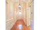 Elegant hallway featuring hardwood floors, arched doorways, decorative moldings, and pendant lighting at 1215 39Th Ne Ave, Hickory, NC 28601