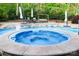 Relax in the attached hot tub and enjoy the lush landscaping at 1215 39Th Ne Ave, Hickory, NC 28601