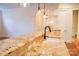 Kitchen island featuring granite countertops, a sink, a faucet, and hardwood floors at 1215 39Th Ne Ave, Hickory, NC 28601