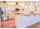 Bright kitchen featuring a large island, granite countertops, stainless steel appliances, and custom cabinetry at 1215 39Th Ne Ave, Hickory, NC 28601