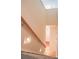 Hallway featuring a wooden banister and lighting fixtures at 1215 39Th Ne Ave, Hickory, NC 28601