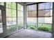 This sunroom offers views of the manicured backyard and lush greenery through numerous windows at 1215 39Th Ne Ave, Hickory, NC 28601