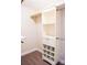 Bright walk-in closet features custom shelving with storage cabinets and a rack for hanging clothes at 1215 39Th Ne Ave, Hickory, NC 28601
