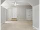 Finished attic space with carpeting, neutral walls, a ceiling fan, and access to extra rooms at 1305 Foxfield Rd # 60, Waxhaw, NC 28173