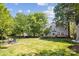 Spacious backyard features a patio, mature trees and green grass at 1305 Foxfield Rd # 60, Waxhaw, NC 28173