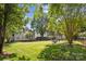 Beautiful backyard features a patio set, mature trees and lush green grass at 1305 Foxfield Rd # 60, Waxhaw, NC 28173