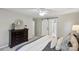 Neutral bedroom features stylish decor, plush bedding, and a dark wood dresser at 1305 Foxfield Rd # 60, Waxhaw, NC 28173
