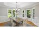 Bright dining room with large windows, hardwood floors, and a decorative chandelier at 1305 Foxfield Rd # 60, Waxhaw, NC 28173