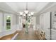 Elegant dining room with tray ceilings, detailed trim, and ample natural light at 1305 Foxfield Rd # 60, Waxhaw, NC 28173