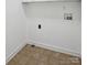 A basic laundry room with tile floors, connections for laundry, and electrical outlets at 1305 Foxfield Rd # 60, Waxhaw, NC 28173