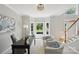 Bright home office with large bay window, comfortable seating, and ample desk space at 1305 Foxfield Rd # 60, Waxhaw, NC 28173