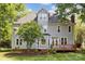 Charming home with a wood deck, large windows, mature trees and green lawn at 1305 Foxfield Rd # 60, Waxhaw, NC 28173