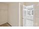Bright walk-in closet featuring shelving and connecting to bathroom for added convenience at 1305 Foxfield Rd # 60, Waxhaw, NC 28173