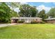 Quaint one story brick home with a car port and green lawn at 1307 Armstrong Rd, Belmont, NC 28012