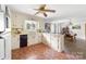Kitchen with black appliances, breakfast bar, and dining area at 1307 Armstrong Rd, Belmont, NC 28012
