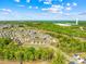 Stunning aerial view of community, showcasing modern homes and lush green landscaping at 13547 Roderick Dr, Huntersville, NC 28078