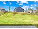 Expansive backyard with lush lawn, iron fence, and view of neighboring homes at 13547 Roderick Dr, Huntersville, NC 28078