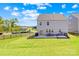 Fenced backyard with green grass and patio area with seating, perfect for outdoor entertaining and relaxation at 13547 Roderick Dr, Huntersville, NC 28078