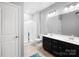Clean bathroom showcasing a double vanity, glass-enclosed shower, and modern fixtures at 13547 Roderick Dr, Huntersville, NC 28078