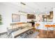 Dining area showcasing a modern table, bench seating, and stylish light fixture near the kitchen at 13547 Roderick Dr, Huntersville, NC 28078