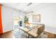 Bright dining area with modern table, chairs, stylish light fixture, and sliding glass door to patio at 13547 Roderick Dr, Huntersville, NC 28078